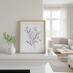 Blue and magenta blossom tree ink painting framed on a bright white fireplace mantle