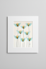 Blue and gold flower botanical artwork in white mat on neutral background